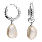 Silver hoop earrings with pearl drops on a white background