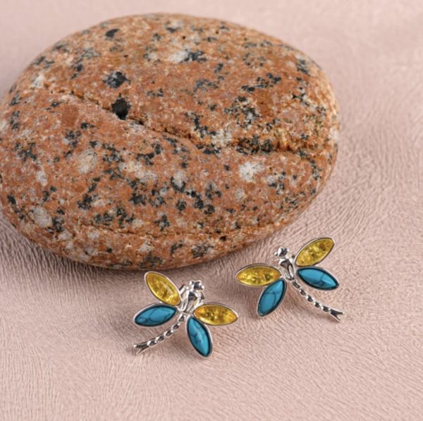 Turquoise and Amber Dragonfly Earrings on pink
