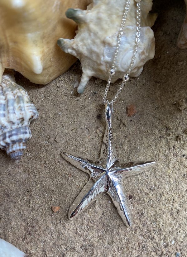 silver starfish pendant close